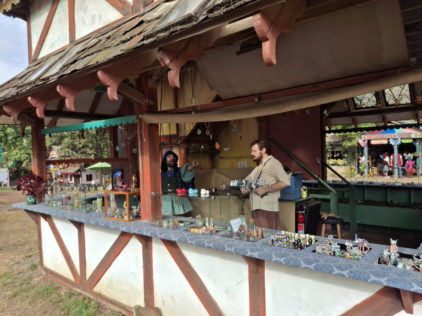 The booth counter with glass pendants and figurines on display